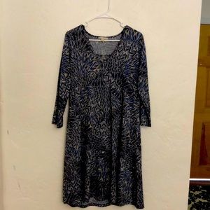 I’m selling a mid sleeve blue design dress. Elegant silver ring in the front.